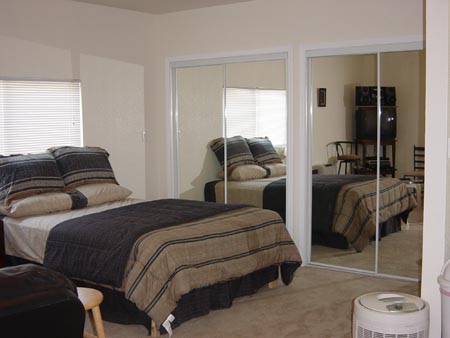 Bedroom after remodel, furnished.